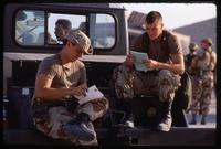 American soldiers reading letters from home during the Gulf War, Dhahran, Saudi Arabia